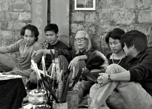 Master artist and his students outside Temple of Literature, Hanoi