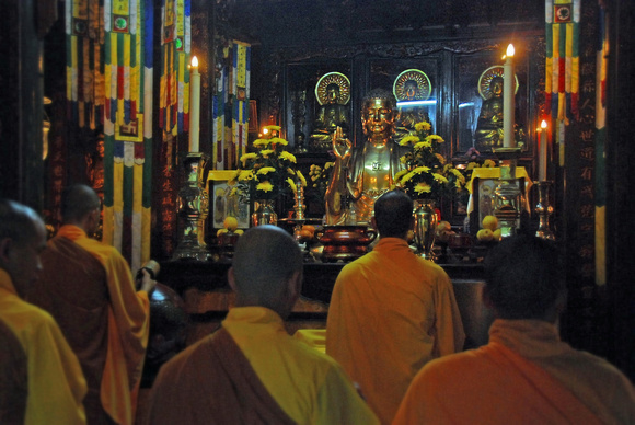 Monks praying in temple, Hue, Vietnam