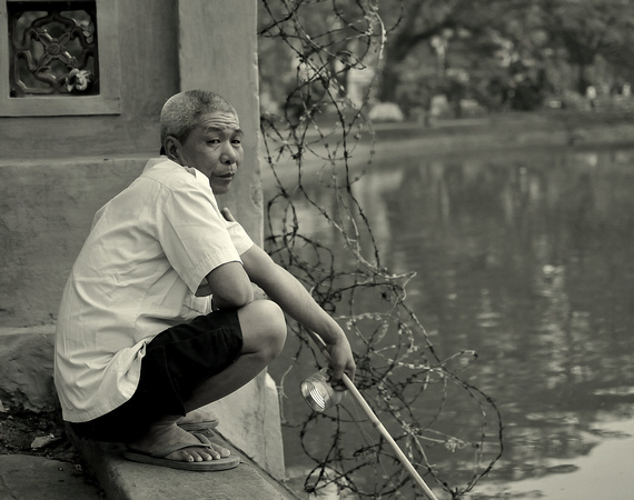 Fishing on Hoan Kiem Lake, Hanoi, Vietnam